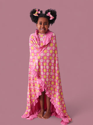 RADIANT SMILES DREAM RUFFLE BLANKET