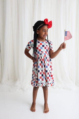 HOME OF THE FREE CHECKERS DREAM RUFFLE DRESS