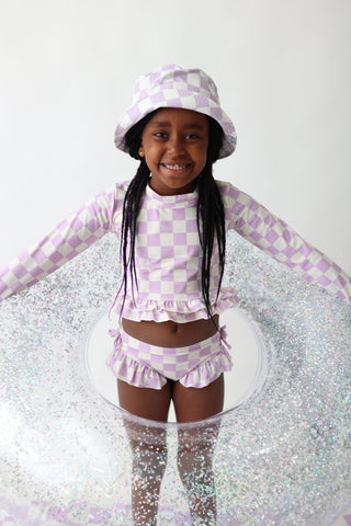 PERIWINKLE CHECKERS DREAM RASH GUARD RUFFLE TWO-PIECE SWIM SUIT